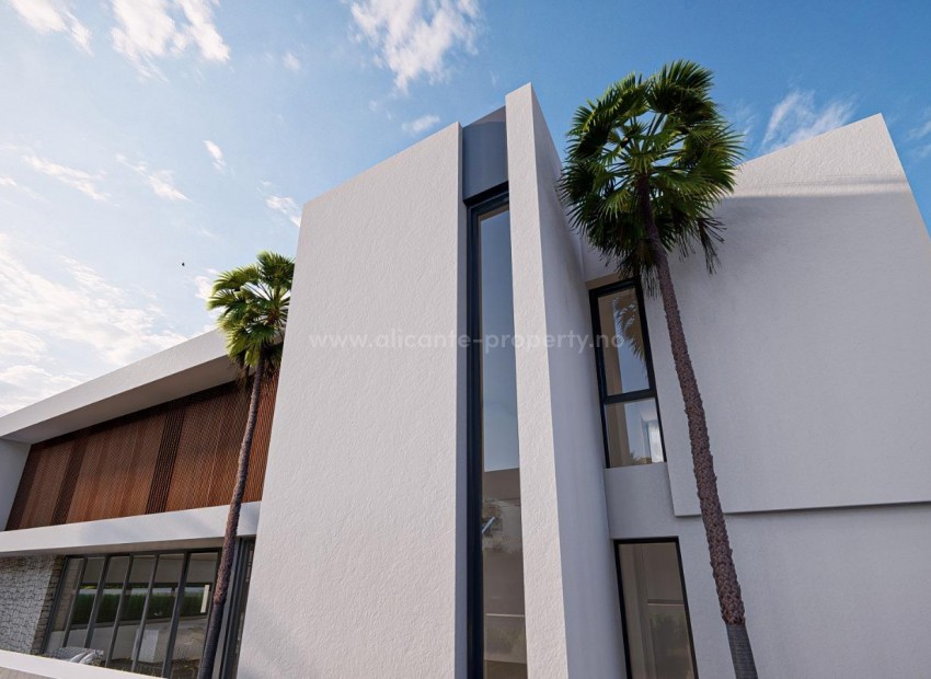 Luxury villa in the seaside resort of Albir, 3 floors, has 4 bedrooms, 4 bathrooms, guest toilet, private garden with swimming pool, terrace and basement with garage